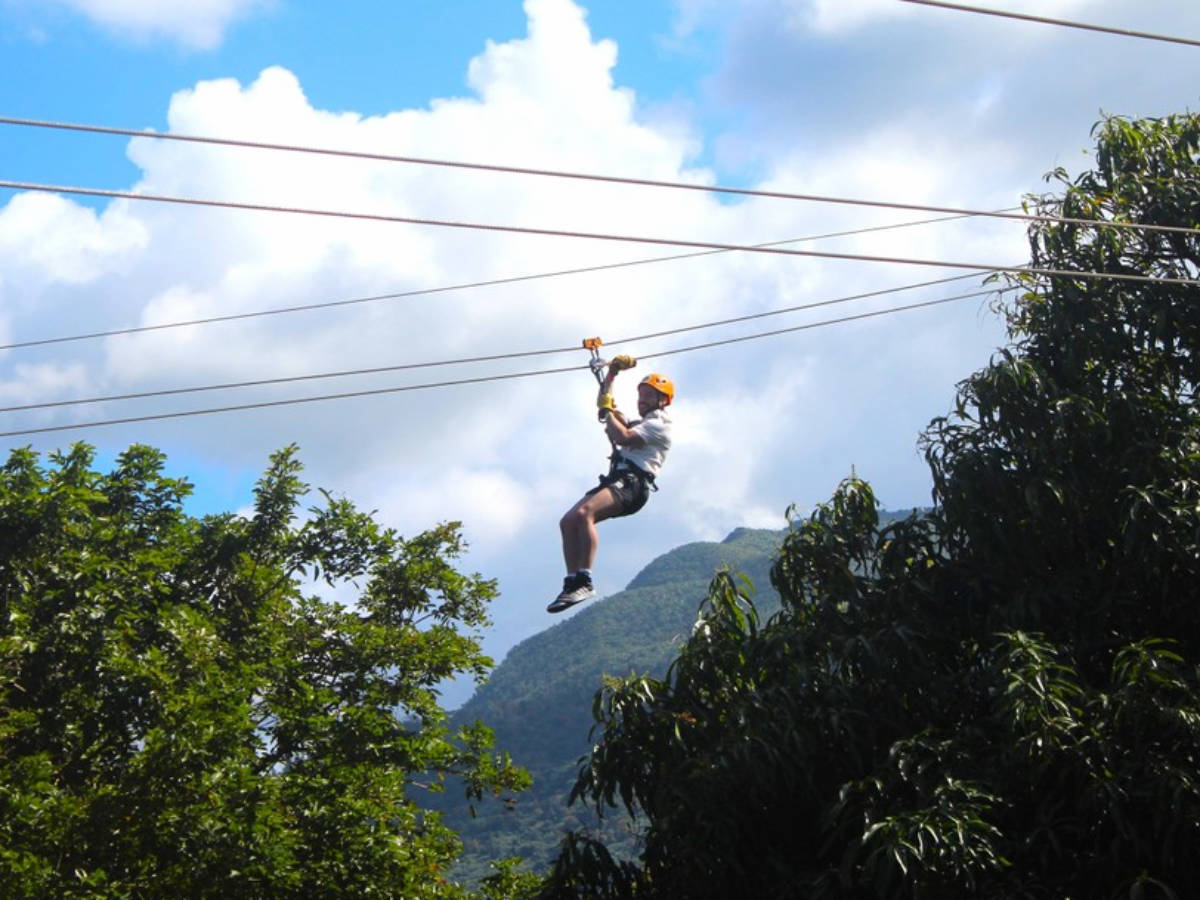 A man enjoying zipline at Rainforest Zipline