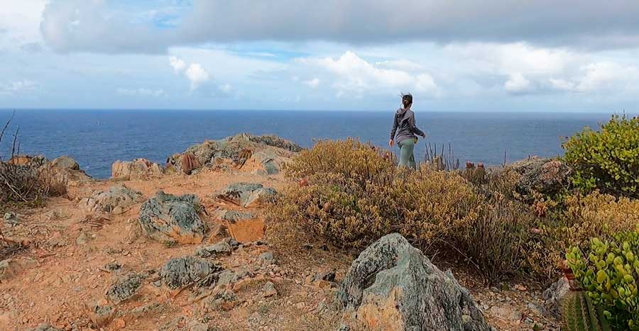 The author's wife with the overlooking view from Ram Head Trail