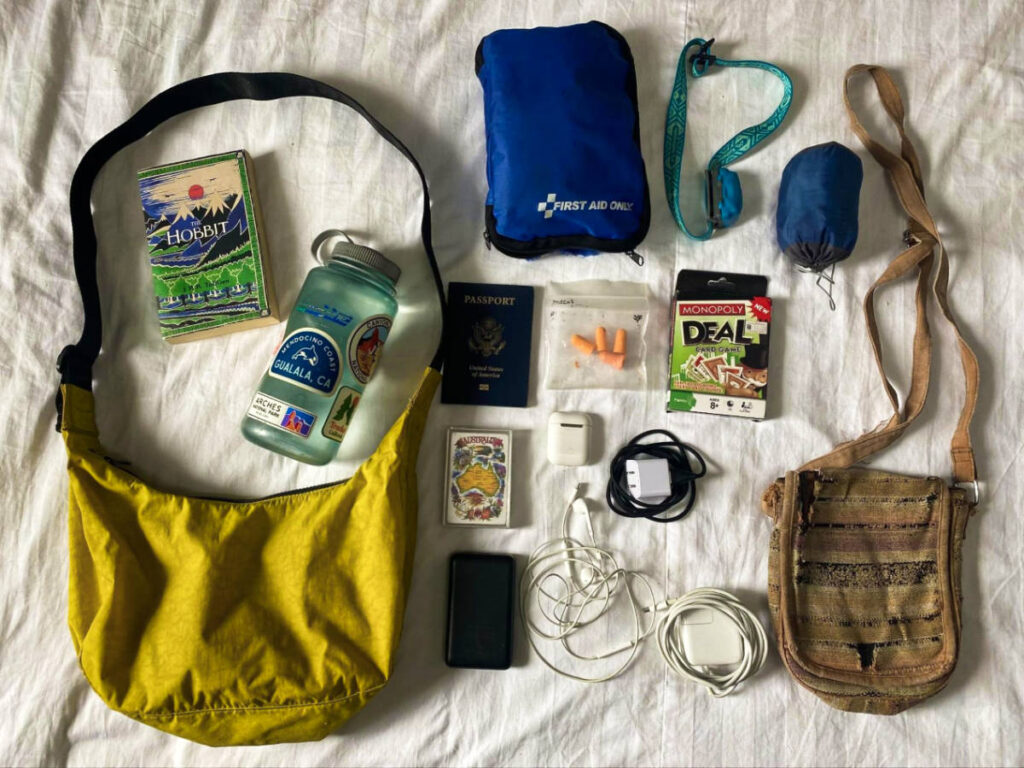 View of the random accessories and the purses on the bed