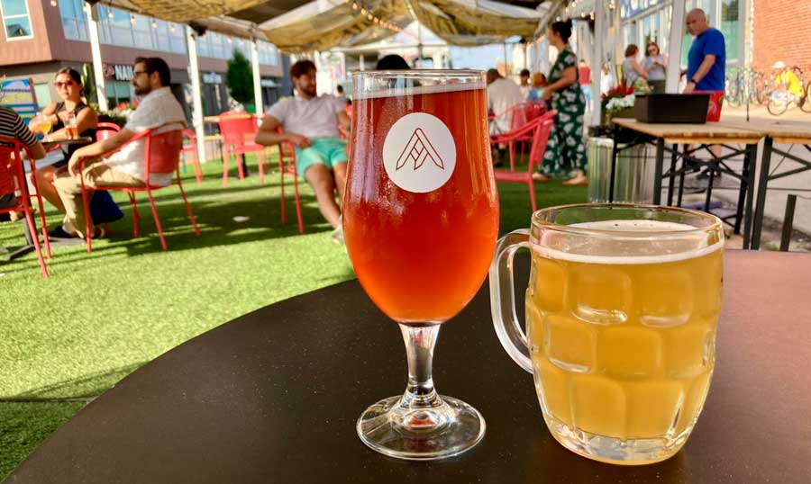 Beers on top of a table on the outdoor area in Ratio Beerworks
