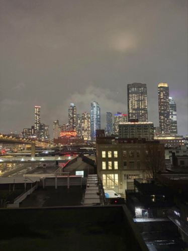 View of the city skyline from the rooftop at night