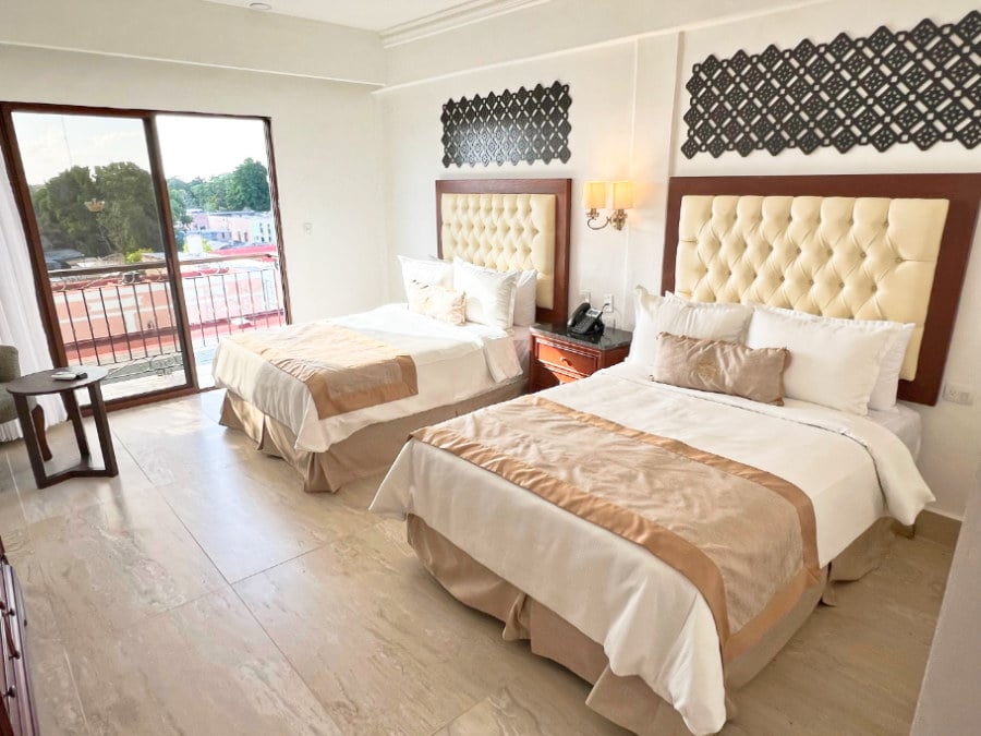 View of two beds in a room at Real Hispano hotel