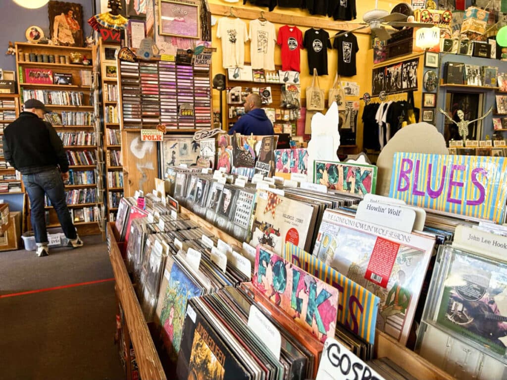 Men browsing the record albums in a record shop in downtown Olympia