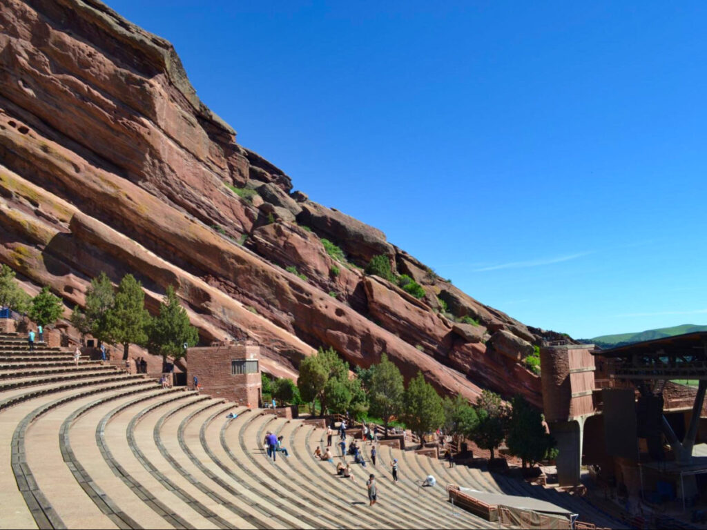 The Red Rocks Park & Amphitheatre outdoor venue surrounded by towering red rocks.