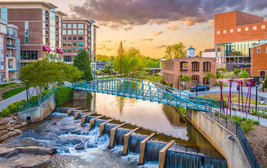 The Reedy River under the colorful sky in Downtown Greenville