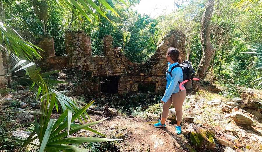 The author's wife passing by the sugar mill ruins along the Reef Bay Trail