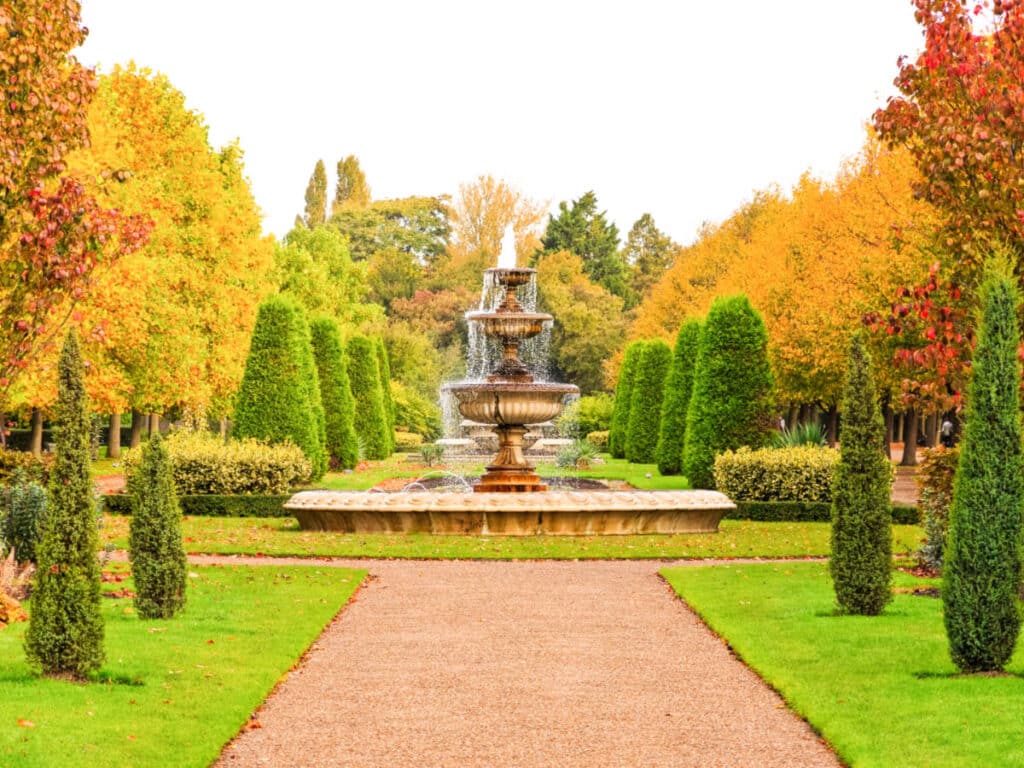 View of the beautiful fountain surrounded by fall foliage in Regent’s Park