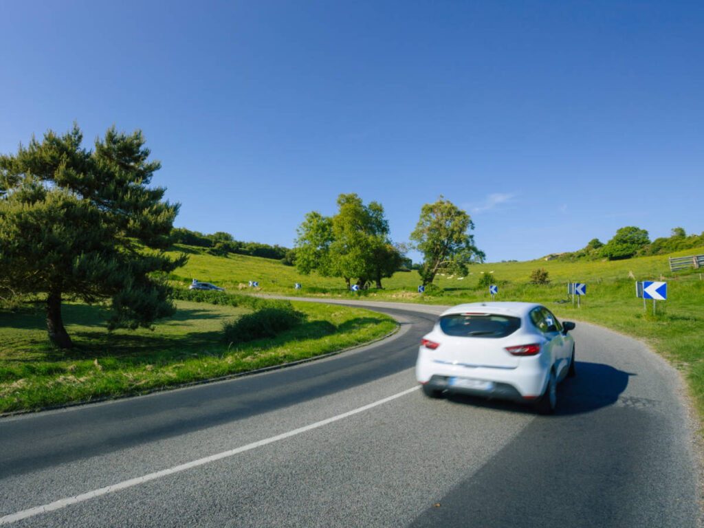 Clear blue sky over a car in Normandy