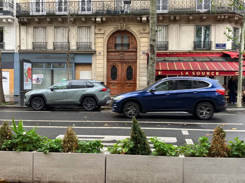Rental cars on a street in Paris