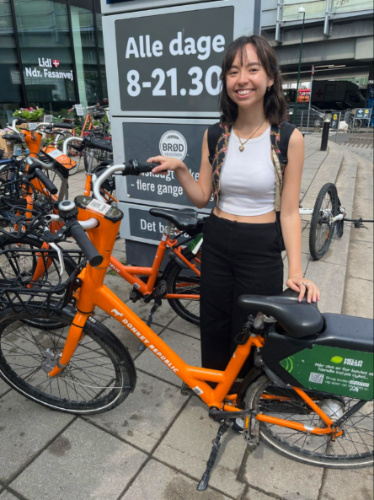 Author Lea Rose holding the Rental bike in Copenhagen