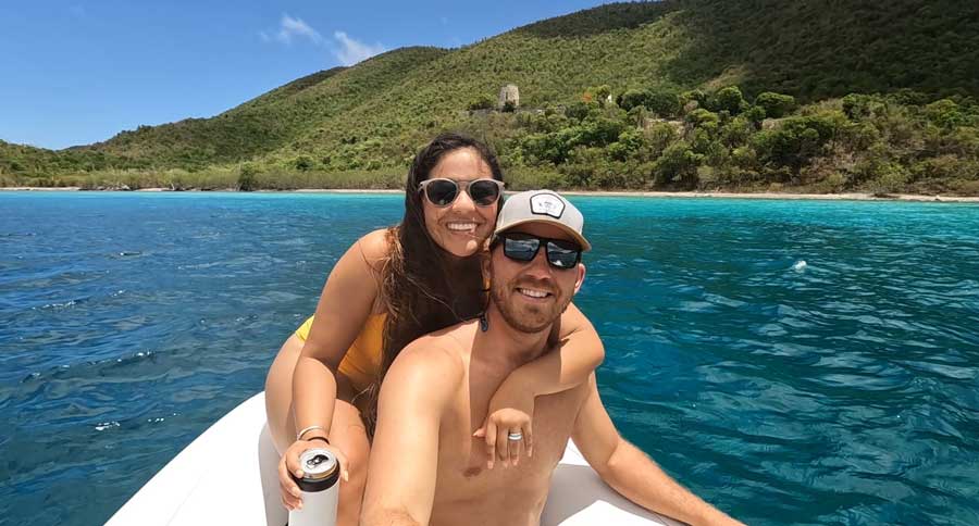The author with his wife posing for a photo while on their dinghy