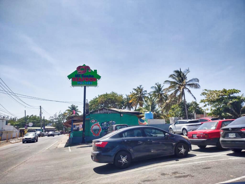 View of the parked cars outside a restaurant at Piñones