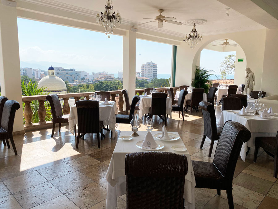 View of chairs and tables on a restaurant in Casa Kimberly