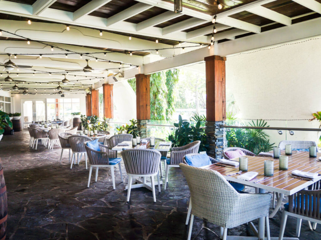 View of the dining tables and chairs at the outdoor patio of Fairmont El San Juan Hotel