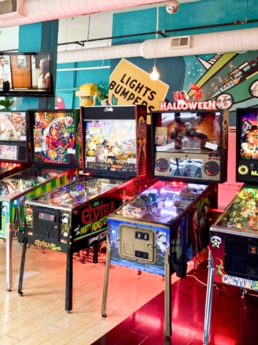 View of the variety of retro arcade games in Superelectric Pinball Parlor