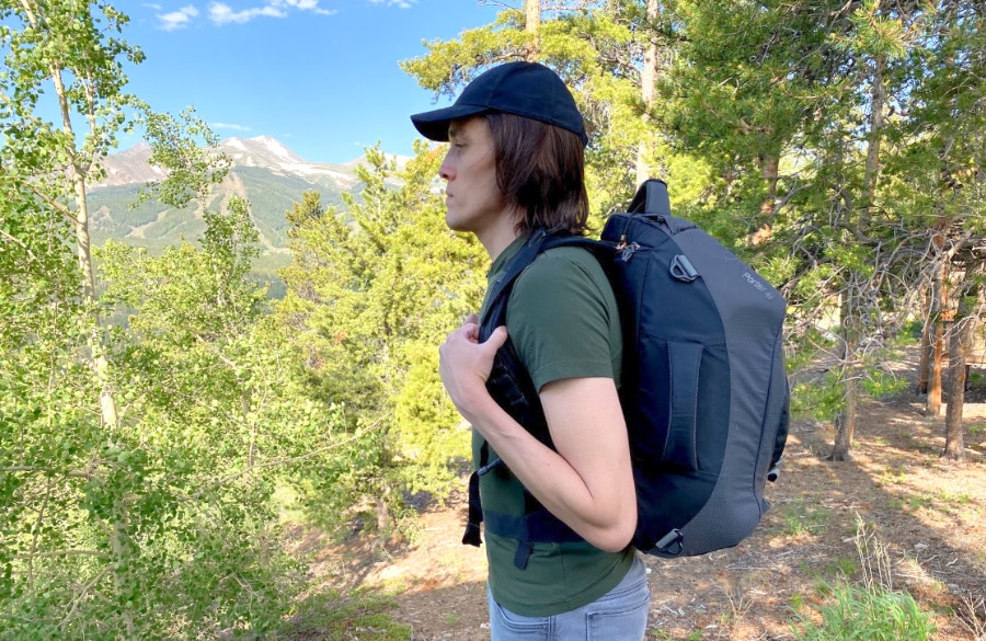 The author standing to the side modeling the Osprey backpack