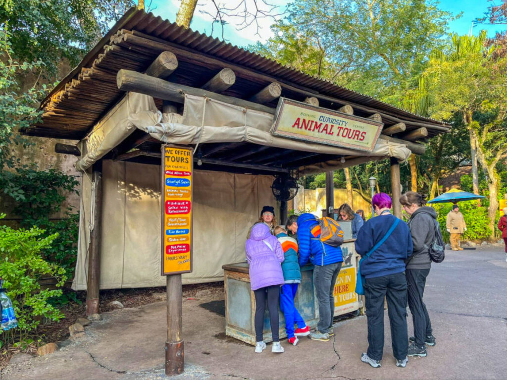 People registering and waiting in line at a Curiosity stand to get Up Close with Rhinos Tour