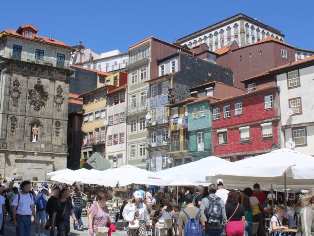 View of Ribeira Square filled with people dining, shopping and exploring
