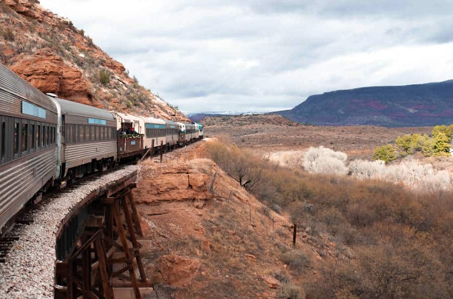 An old train passing the scenic views at the Verde Canyon Railroad