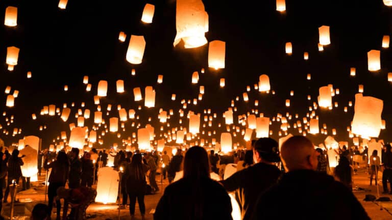 People releasing the illuminated lanterns during the Rise Festival