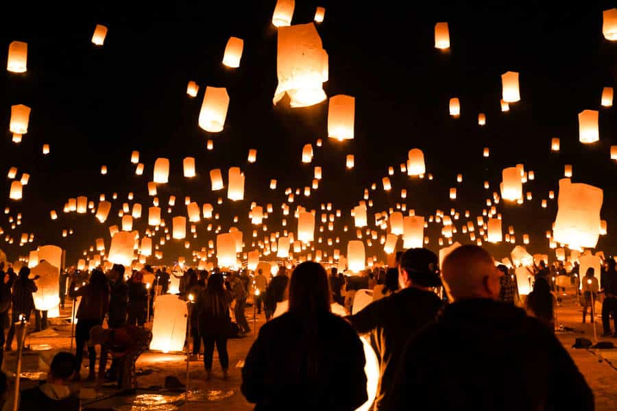 People releasing the illuminated lanterns during the Rise Festival
