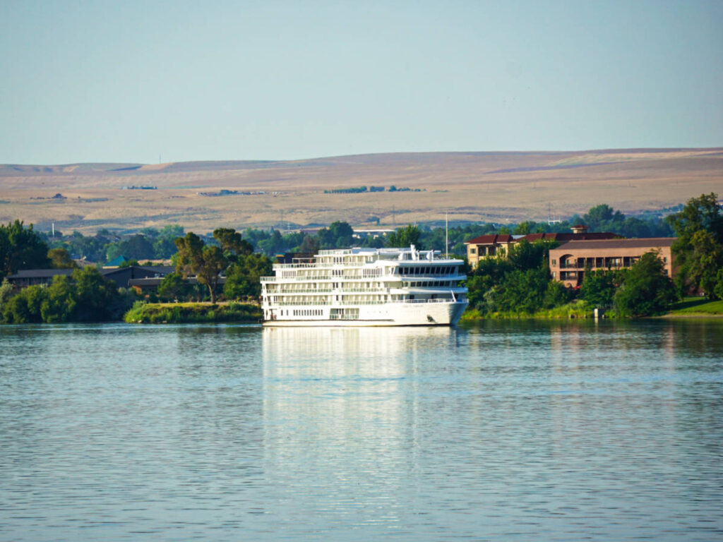 A river cruise ship docked at the Howard Amon Park