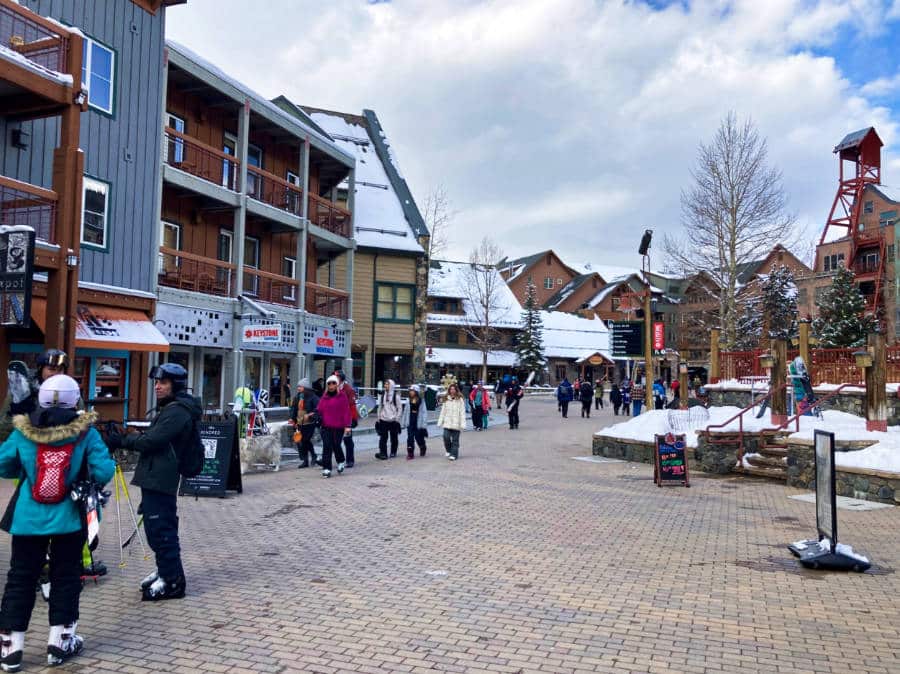 People wandering around the River Run Village