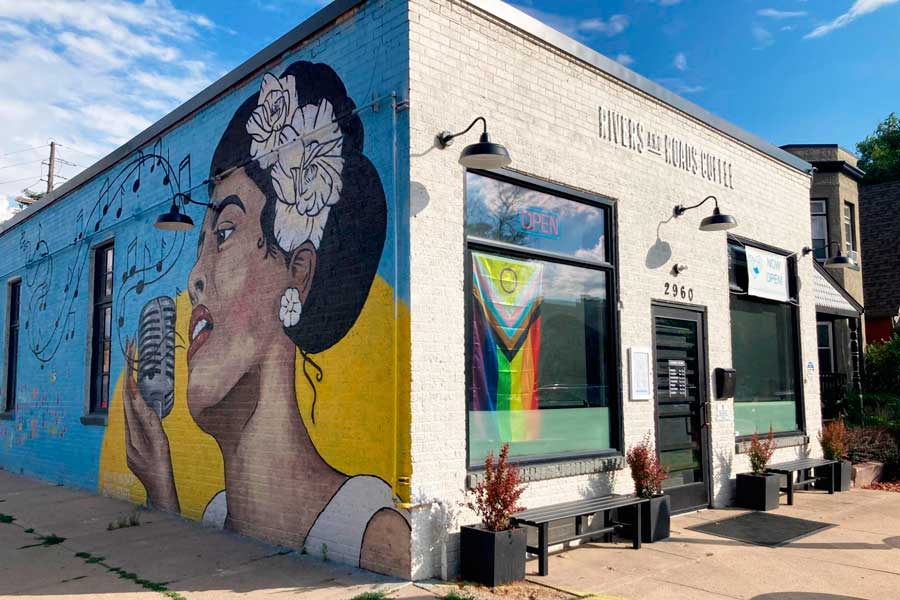 A colorful art wall in the Rivers and Roads Coffee establishment