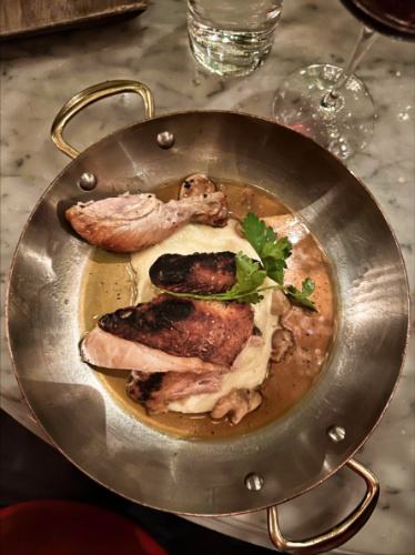 The roast chicken with potatoes on a small pan