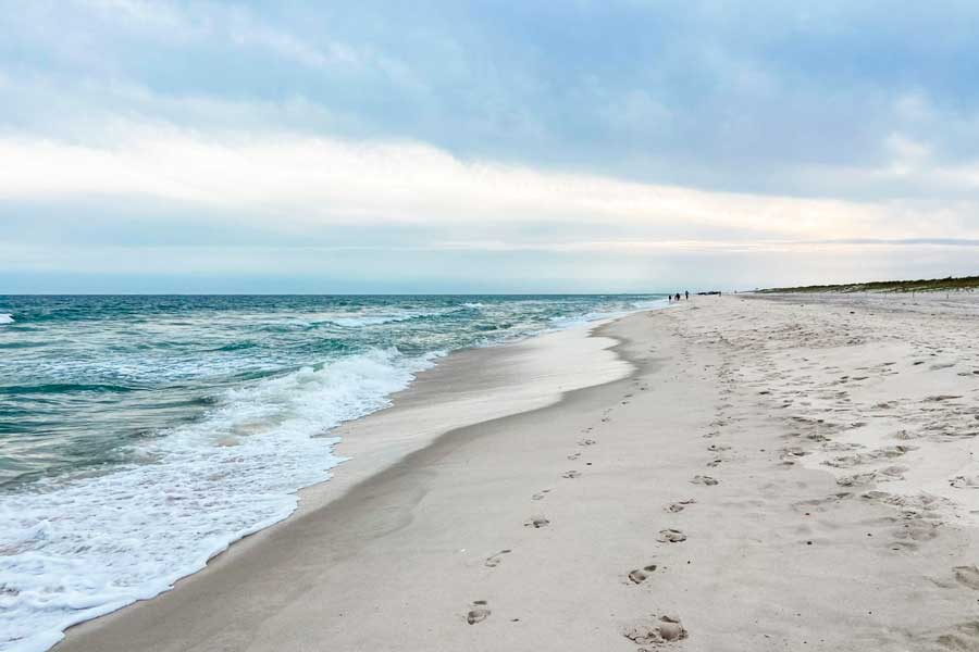 View of the shoreline in Robert Moses State Beach before sunset
