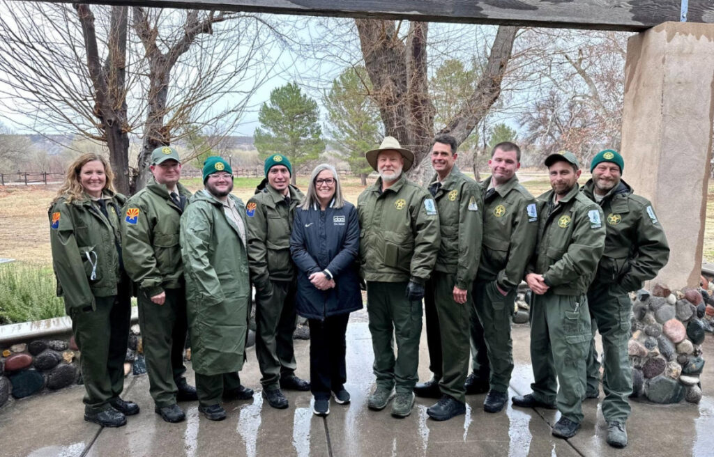 The staff of Rockin River Ranch posing for a photo with Arizona Governor Hobbs