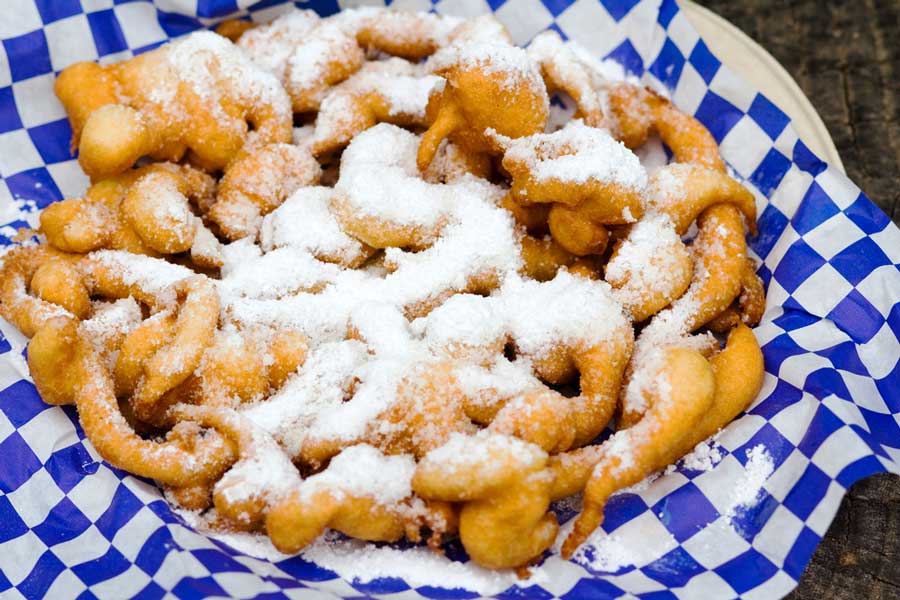 View of a funnel cake with sugar on it