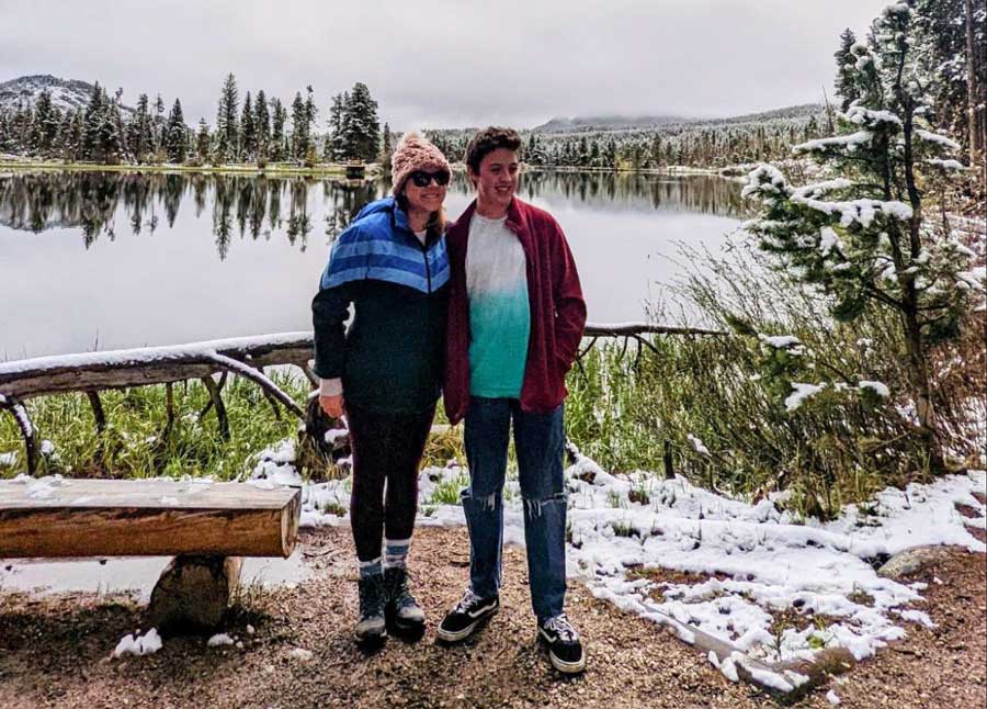 The author with her son smiling for a photo in Rocky Mountain National Park