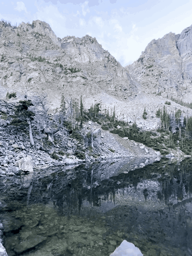 Reflection of the Rocky Mountain on a lake in Colorado