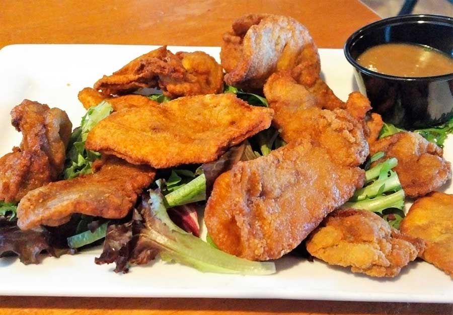Rocky Mountain Oysters with a dip on the plate
