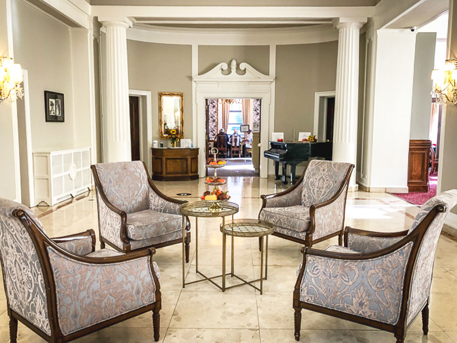 View of chairs and table on the center inside the Rodd Charlottetown