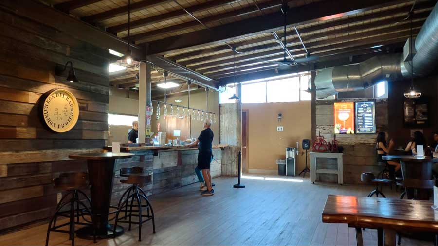 A man ordering on the counter of Ron del Barrilito