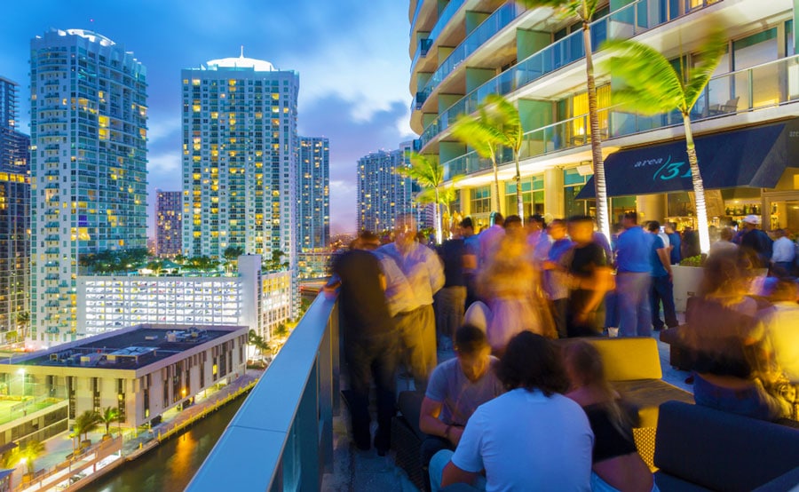 View of people in a rooftop bar in Miami