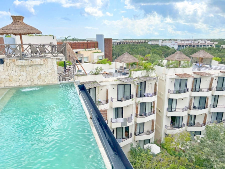 View of rooftop pool and hotel rooms at Naala Tulum