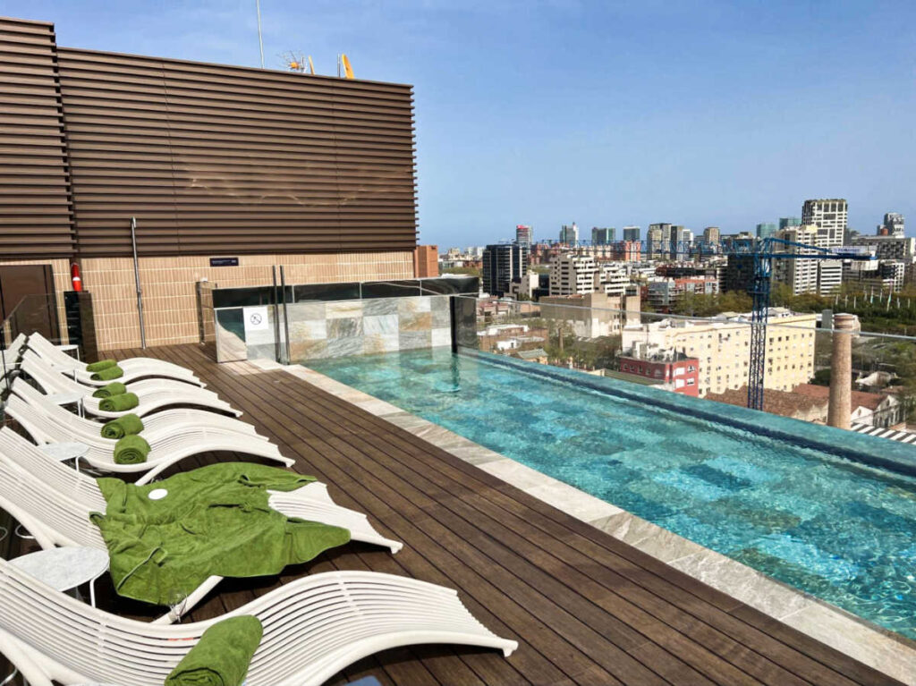 View of the lined lounge areas at the rooftop pool of LabTwentyTwo