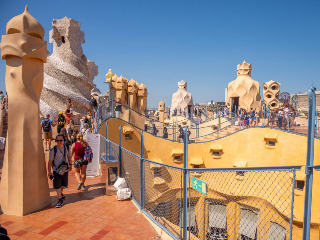 People visiting the statues and exhibits at the Rooftop of La Pedrera-Casa Milà
