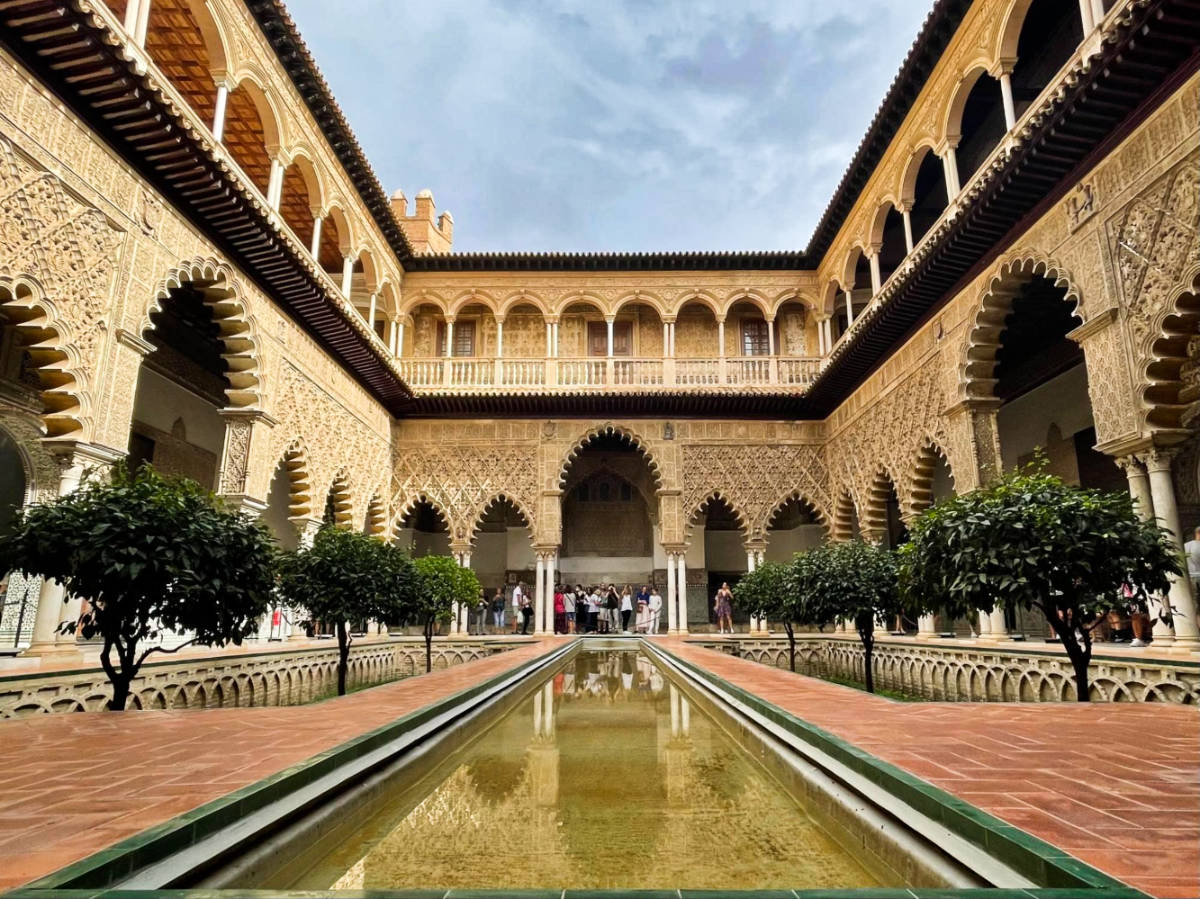 Clear blue sky over the Patio de Doncellas at Royal Alcázar in Seville