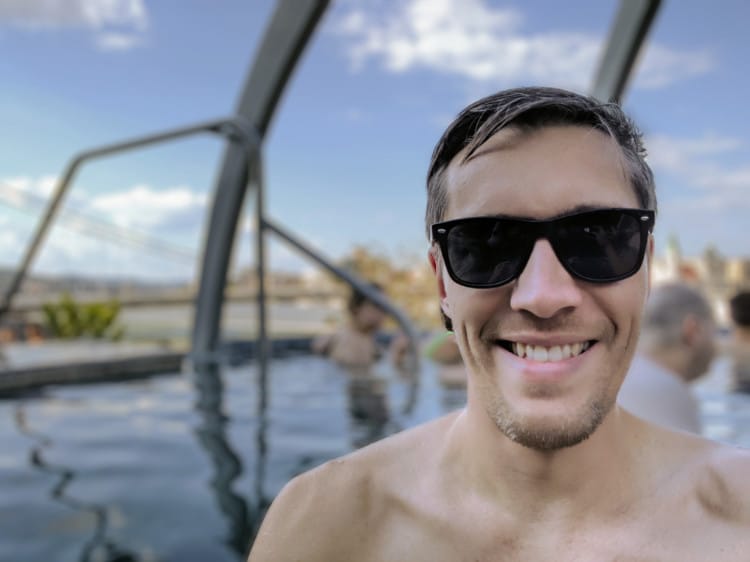 The author, Nate Hake, taking a selfie from the hot tub atop Rudas Baths