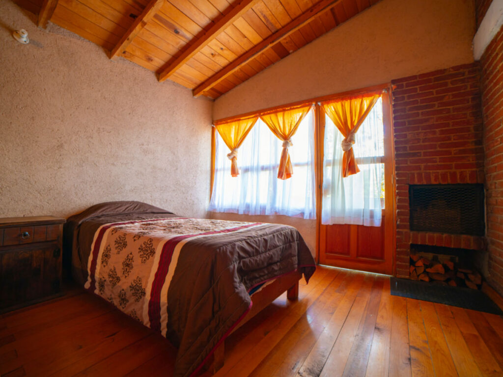 Interior of a rustic brick cabin and wooden roof