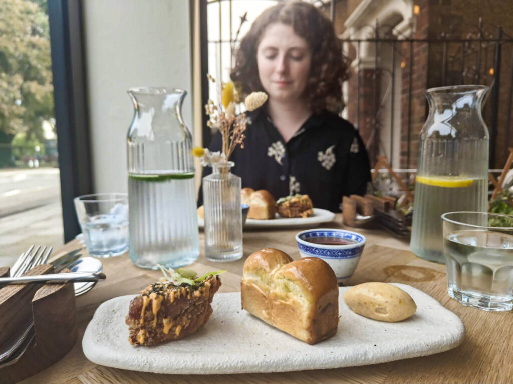 The author Ruthie Walters enjoying the food served in Hiraeth