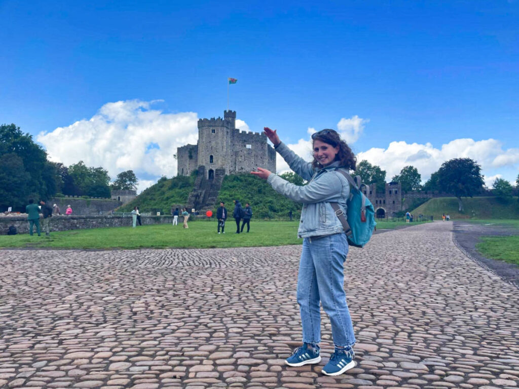 The author Ruthie Walters, "holding" the Norman Keep, Cardiff Castle