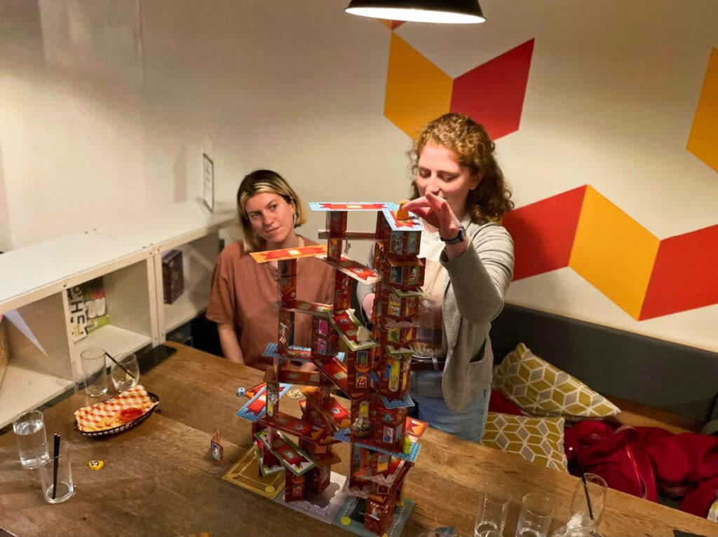 The author Ruthie Walters and friend, playing a board game