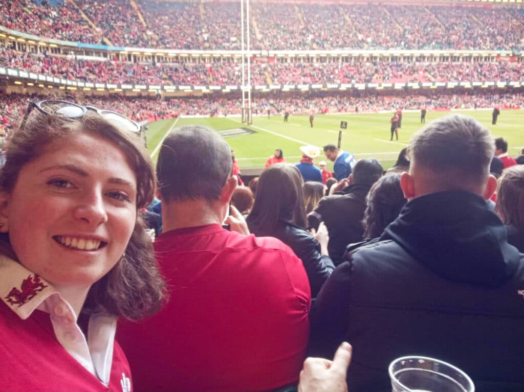The author Ruthie Walters, watching a game with the crowd at The Principality Stadium