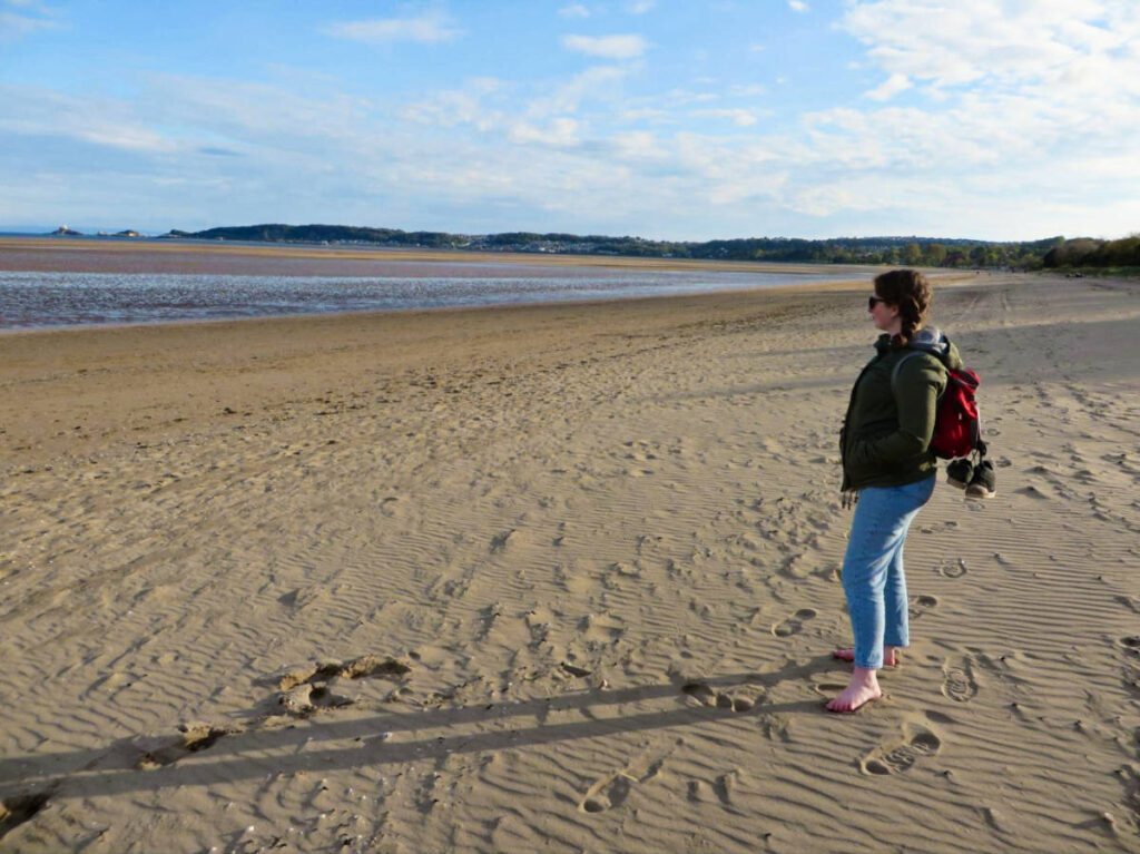 The author Ruth Elizabeth Walters, enjoying the peaceful Swansea beach