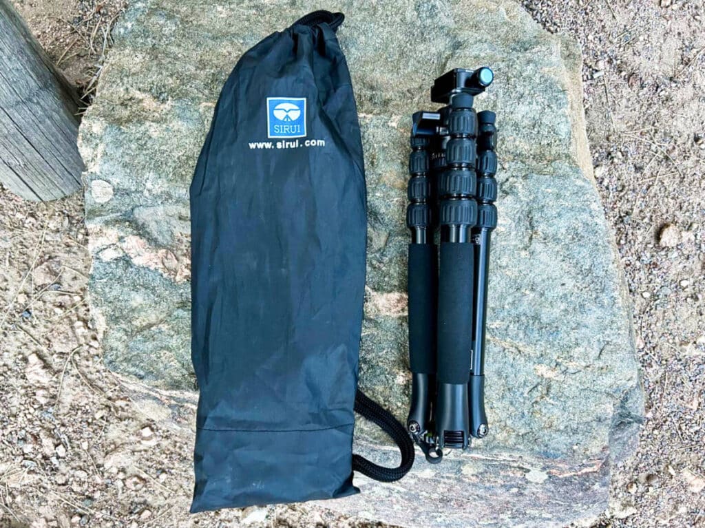 A drawstring bag with the folded length of SIRUI T-005X Ultralight Travel Tripod